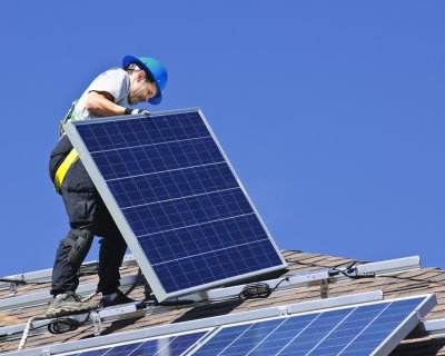 Man Installing Solar Panel