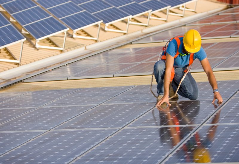 Technicians installing solar panels