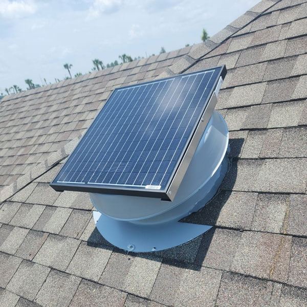 An attic fan mounted on a residential roof in Ocala, FL