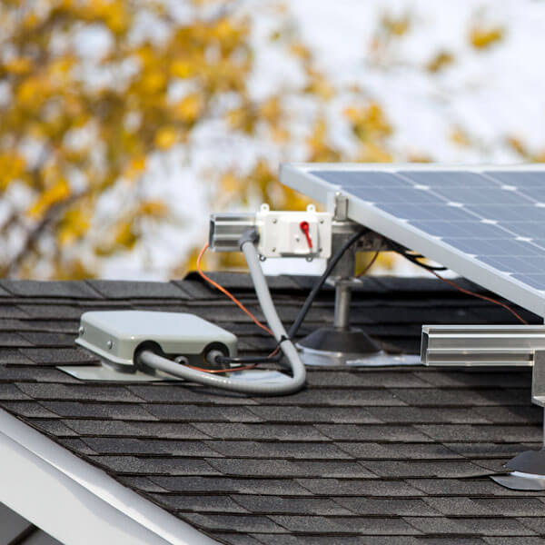 Solar panels and inverter on a residential home up close