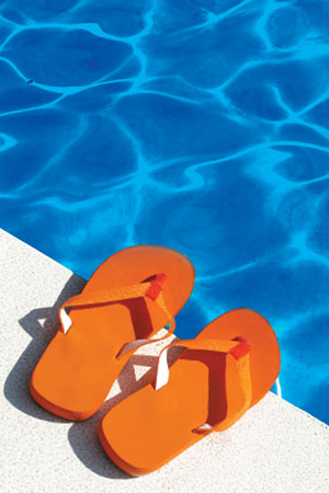 orange flip flops by the pool