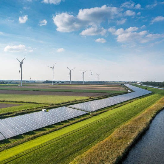 Solar panels and windmills are installed at a farmland and riverside in Ocala, FL.