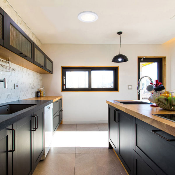 natural light inside kitchen from tubular skylight