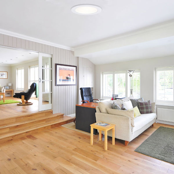 natural light inside living room and den from tubular skylight